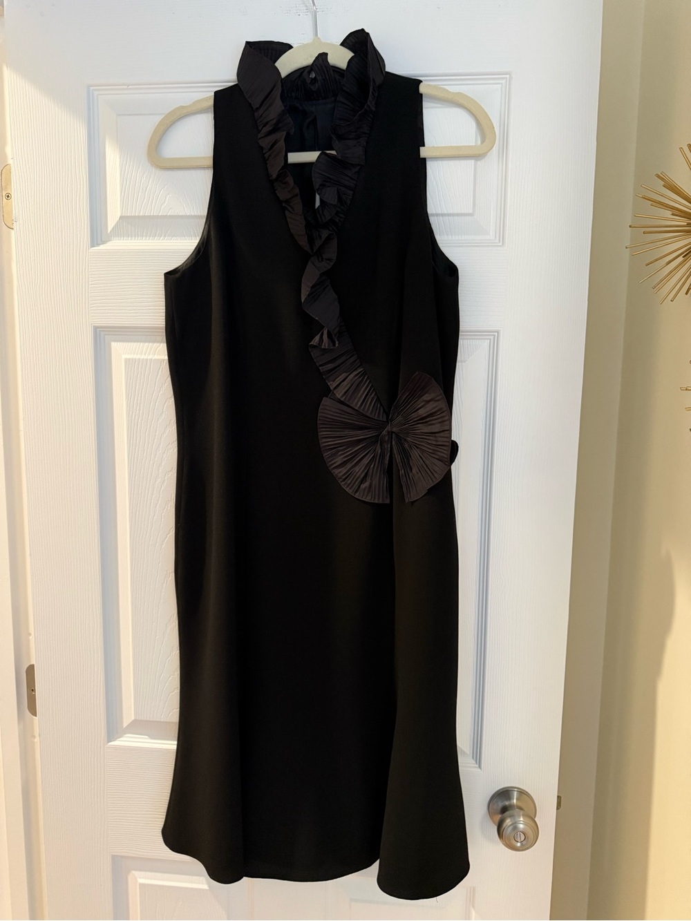 Black Crepe Cocktail Dress with Ruffle and Bow Accents.